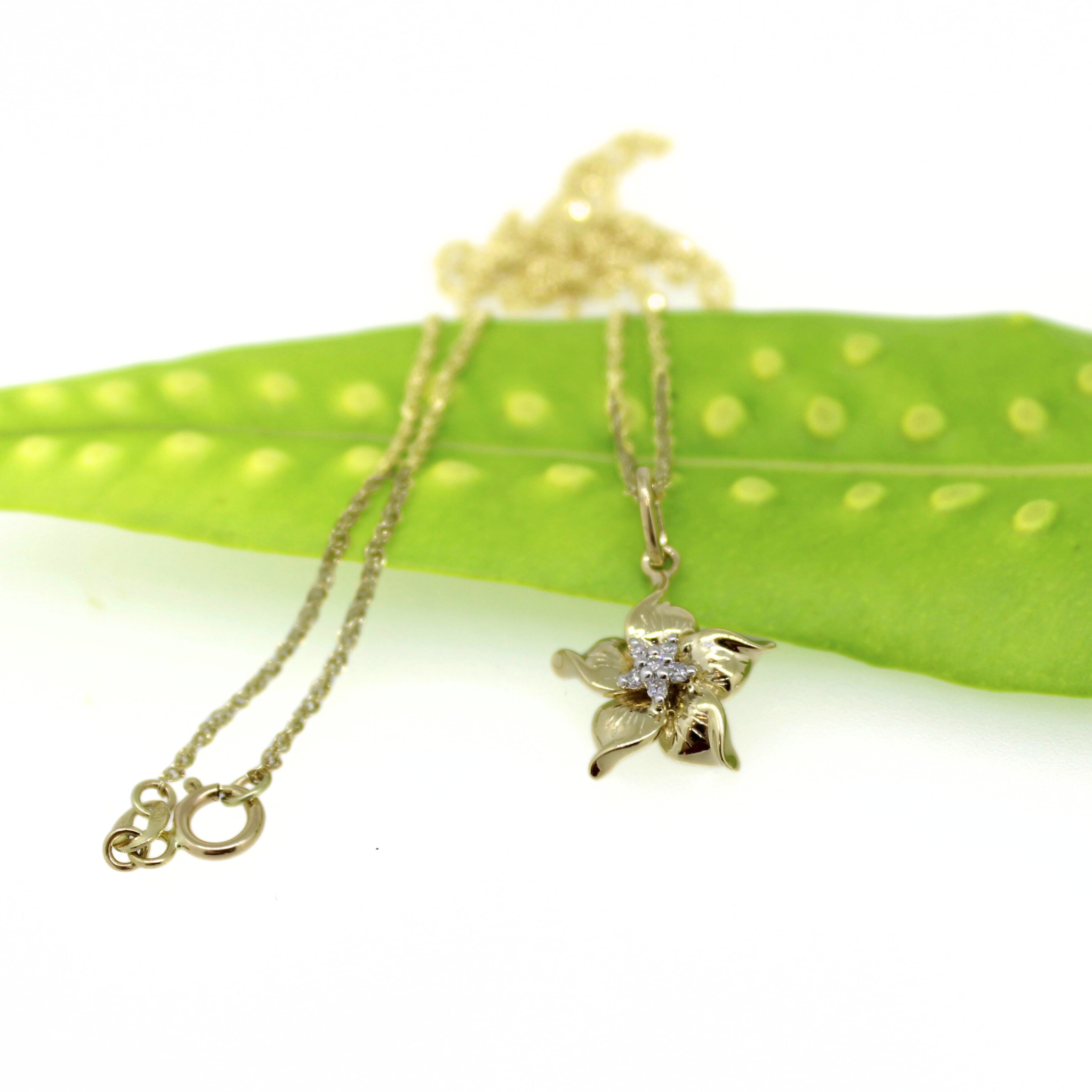 Brianne & Co. 14k gold flower diamond pendant on an 18" baby rope chain