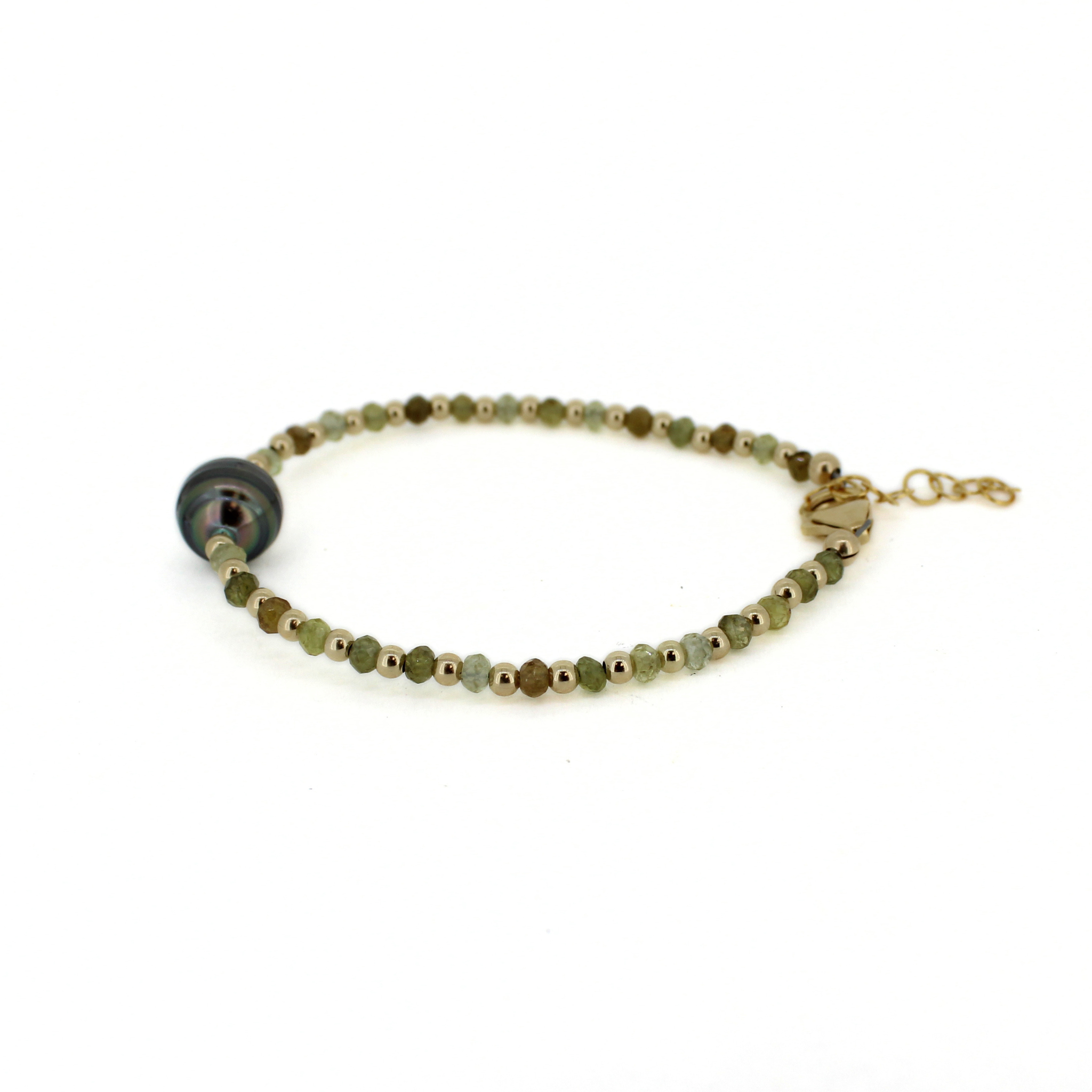 Beaded bracelet with round dark Tahitian-style pearl and small green stones, gold clasp