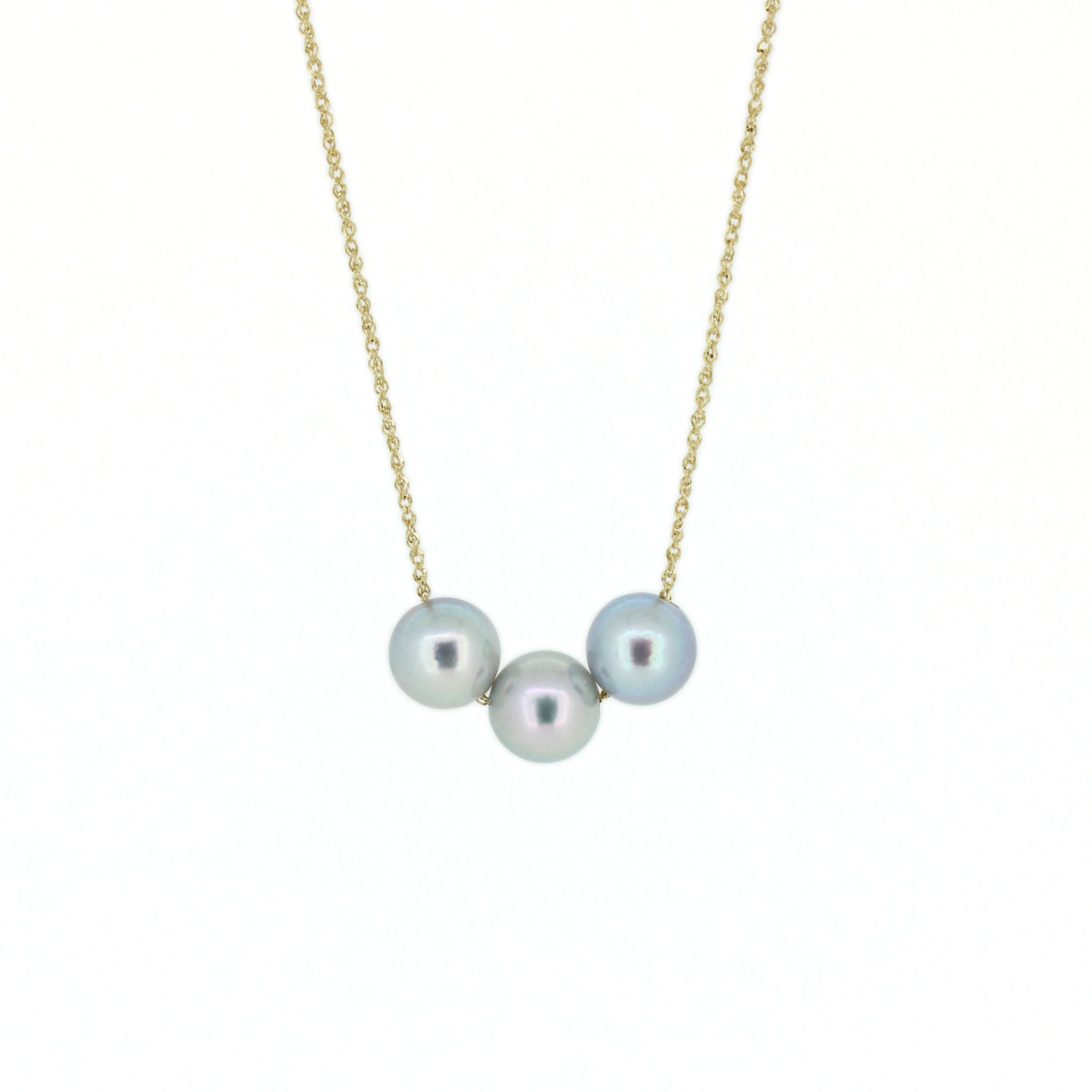 A delicate gold chain necklace featuring three round, lustrous akoya pearls, displayed against a solid white background. Handmade in Kauai, Hawaii by Brianne & Co.