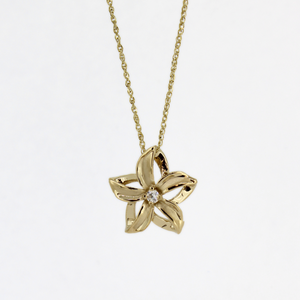 14k solid gold necklace featuring a delicate cut out flower pendant with a diamond accent from Brianne and Company