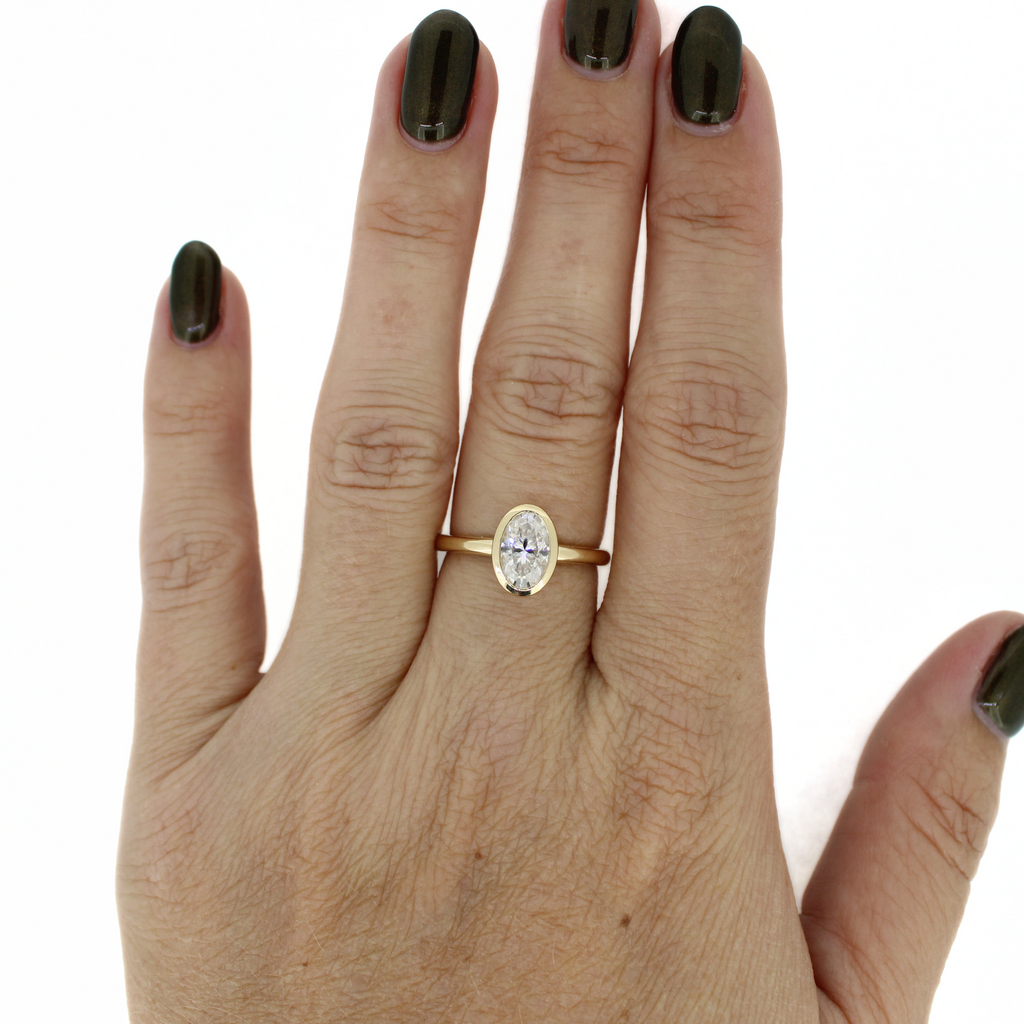 Brianne & Co. oval moissanite ring in 14k gold on model