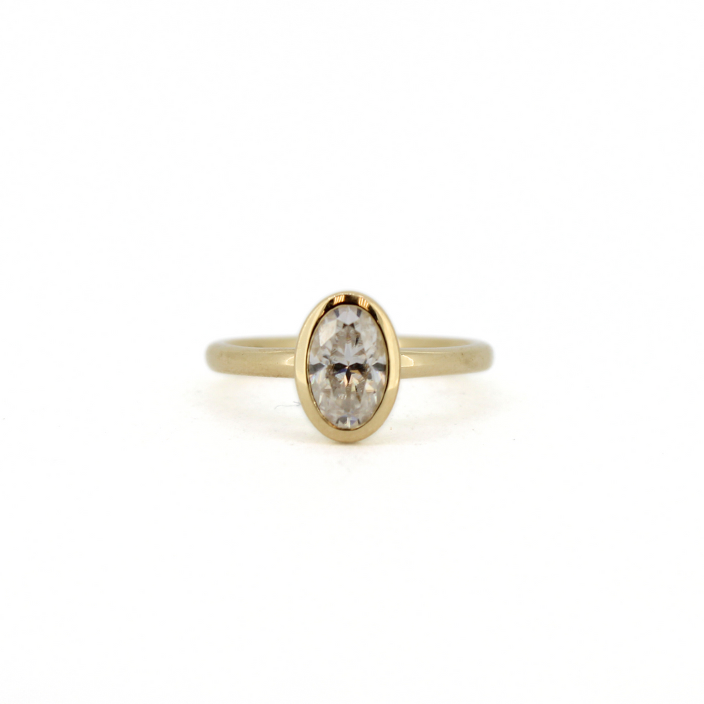 Brianne & Co. bezel set oval moissanite ring in 14k gold