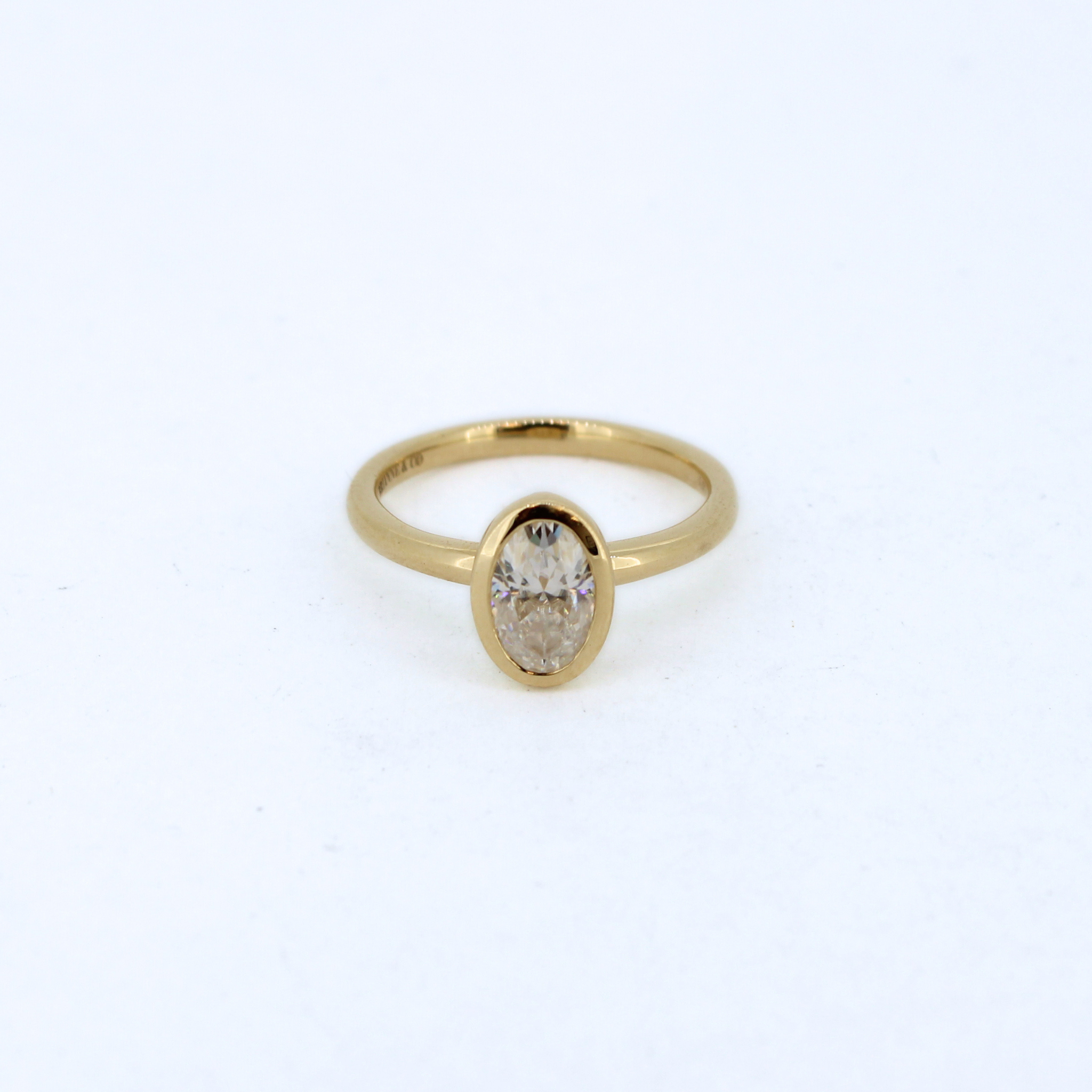 Bezel set oval moissanite ring by Brianne & Co