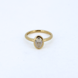 Bezel set oval moissanite ring by Brianne & Co