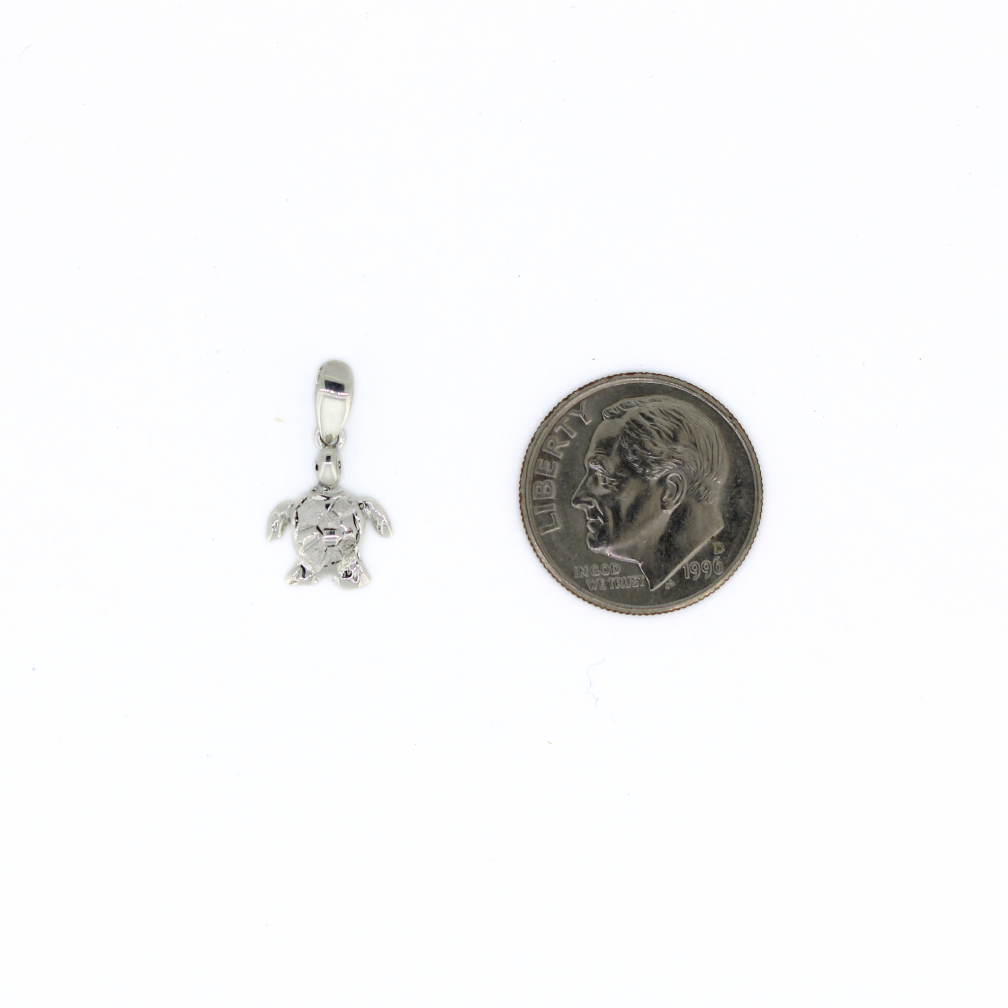 Sterling Silver Honu Pendant Next To A Dime by Brianne & Co.