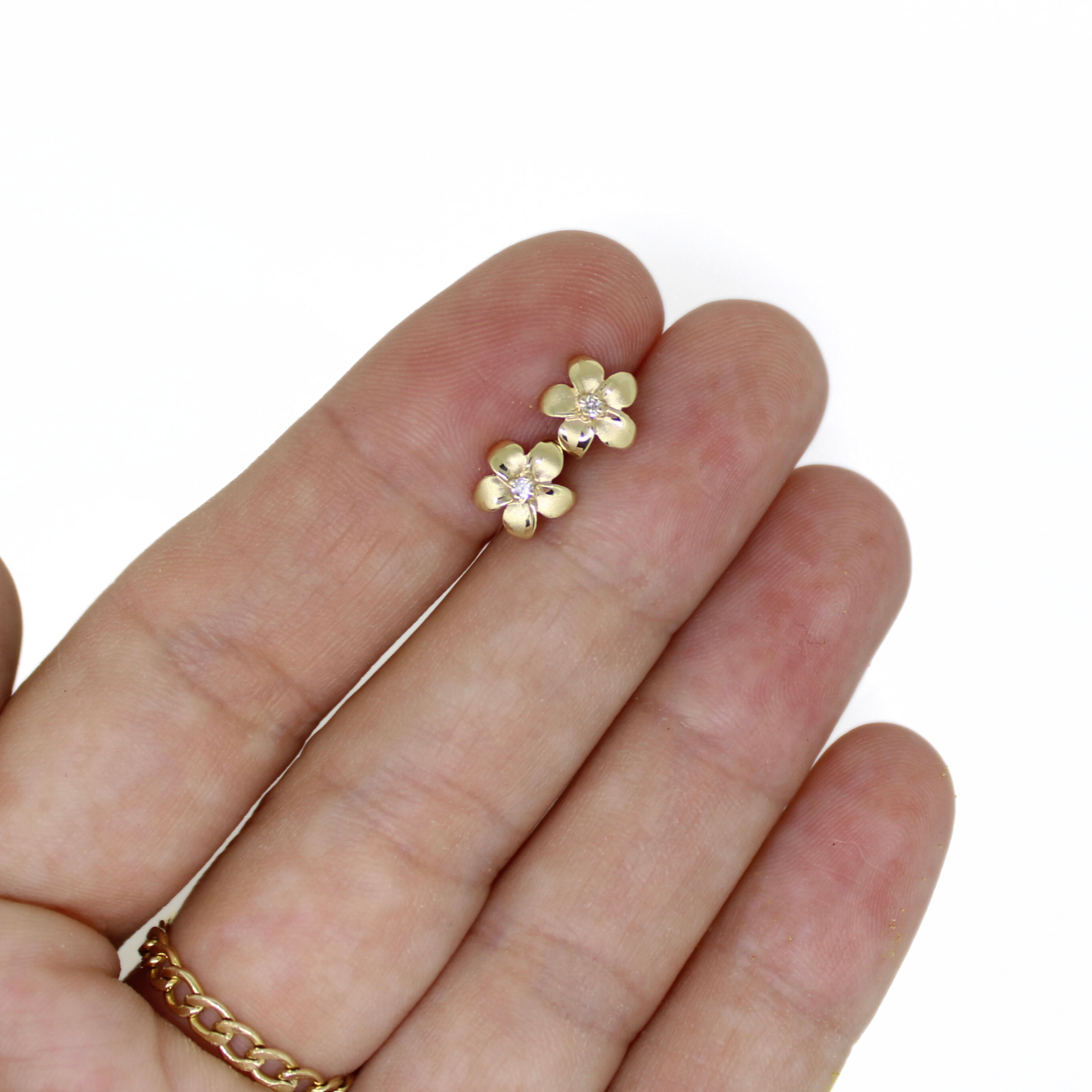 14K gold plumeria stud earrings with tiny round diamonds on thin posts