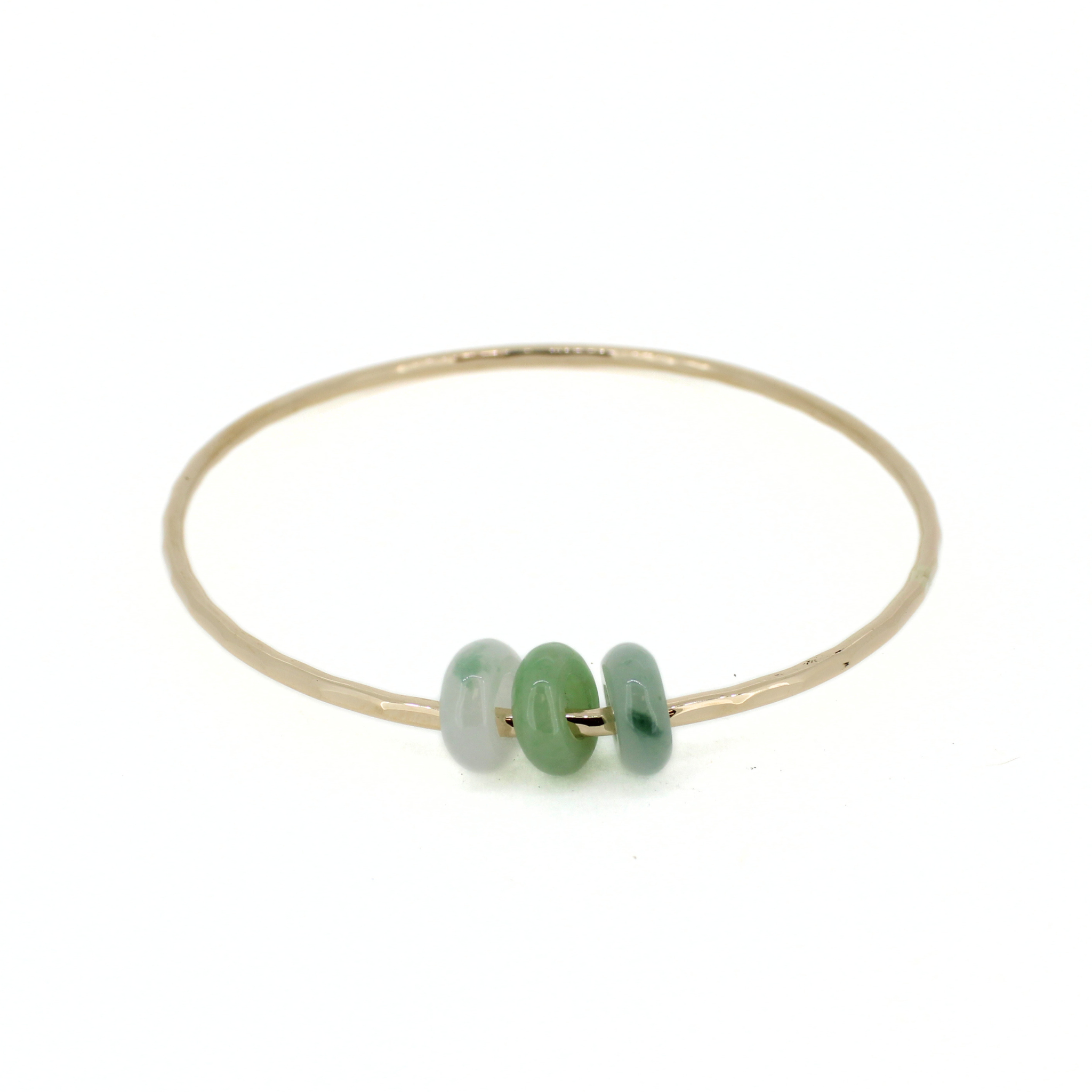 Brianne & Co. 14k gold fill hammered bangle bracelet with three colorful green jade donut beads