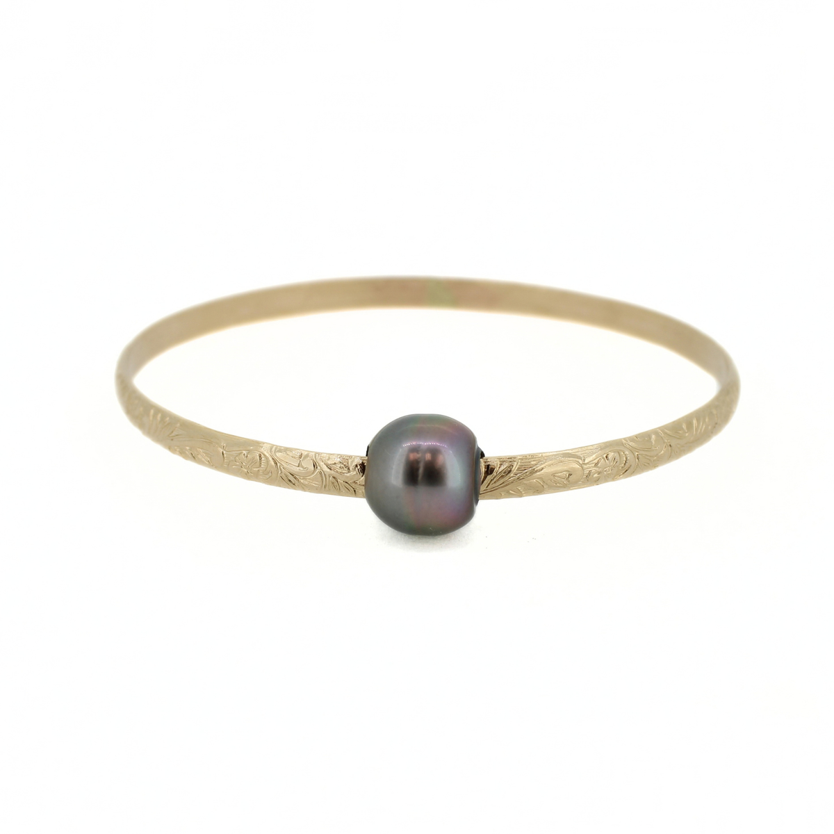 Gold floral designed bangle bracelet with a dark Tahitian pearl shown against a white background