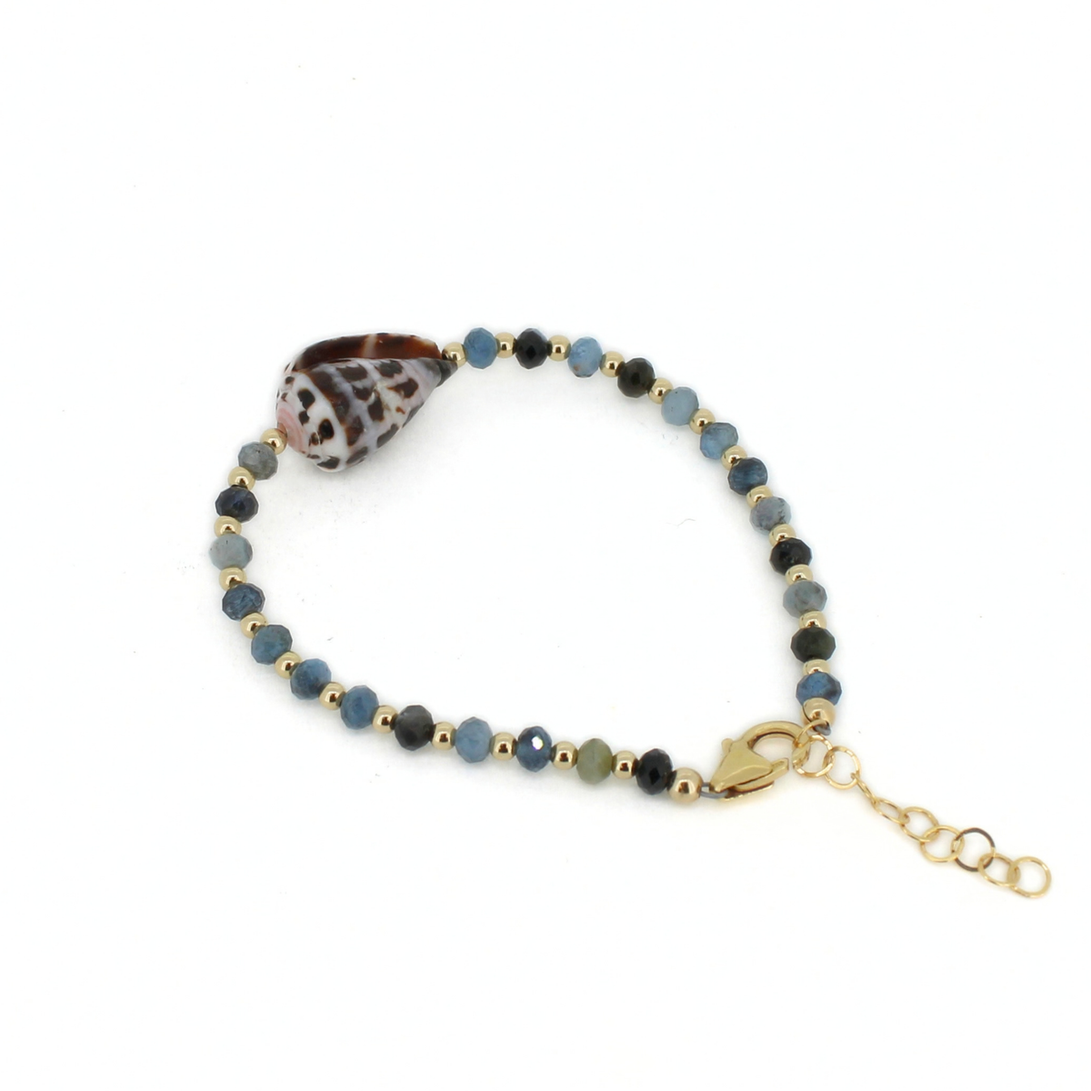 A beaded bracelet featuring faceted blue and gray beads, small gold spacer beads, a brown and white patterned seashell, and a gold lobster clasp with an adjustable chain extender, shown on a plain white background.