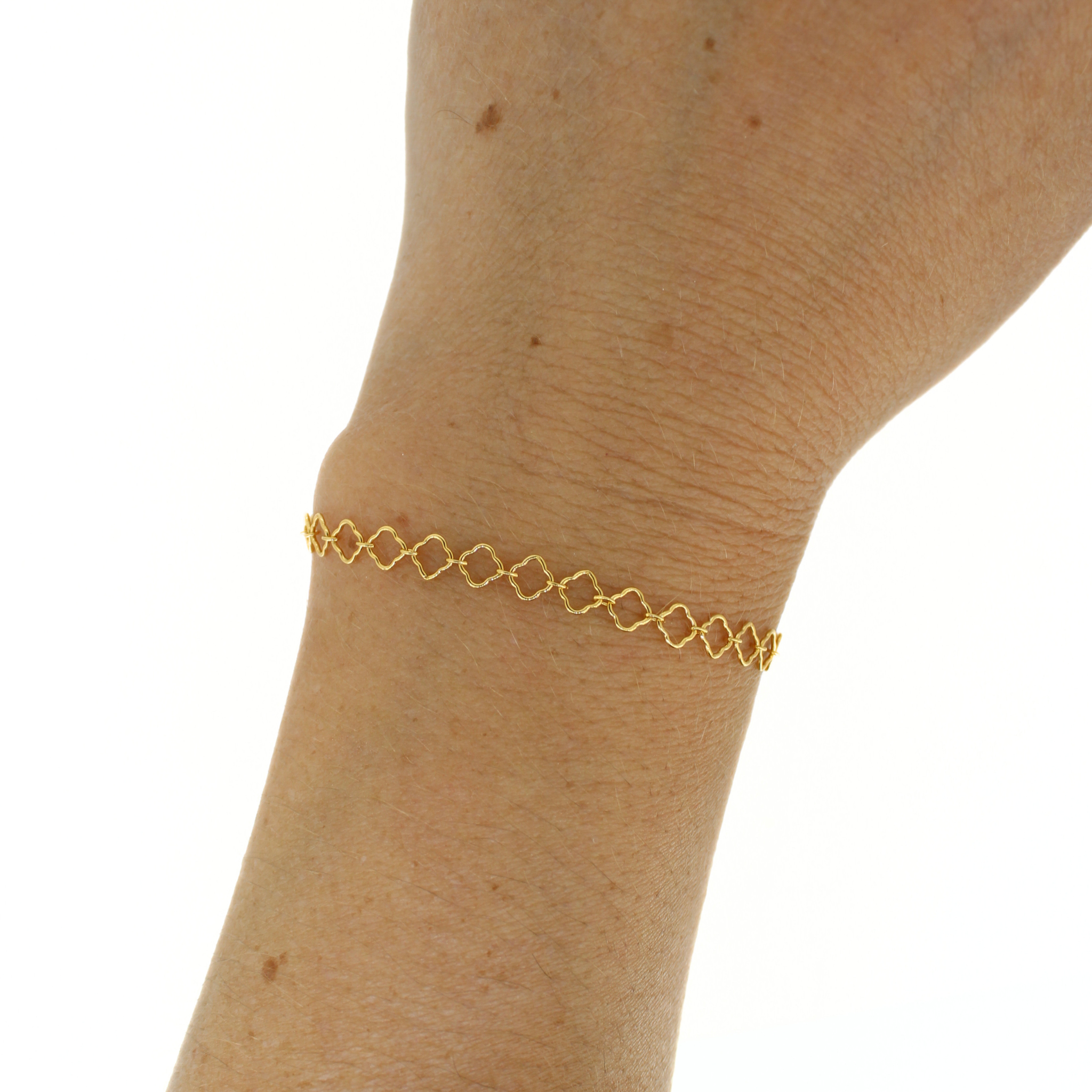 Brianne & Co. gold fill clover chain bracelet on wrist