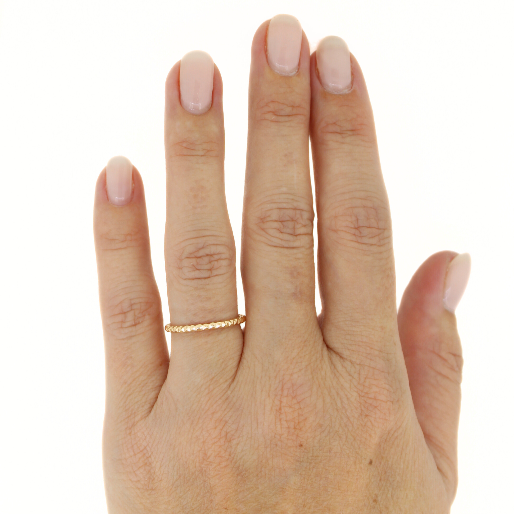 Brianne & Co. gold fill faceted stacker rings on hand model