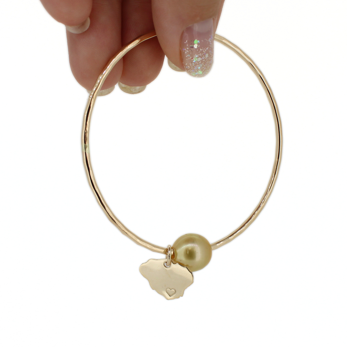 Brianne & Co. 14k gold fill round bangle bracelet featuring a golden south sea pearl and Kauai island charm