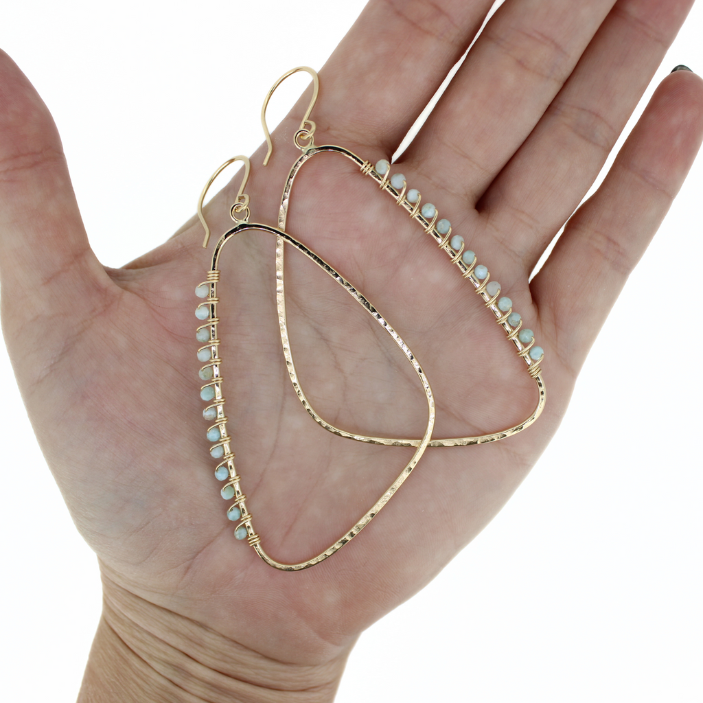 Extra large wing shaped hoops in gold fill with blue larimar gemstones by Brianne & Co.