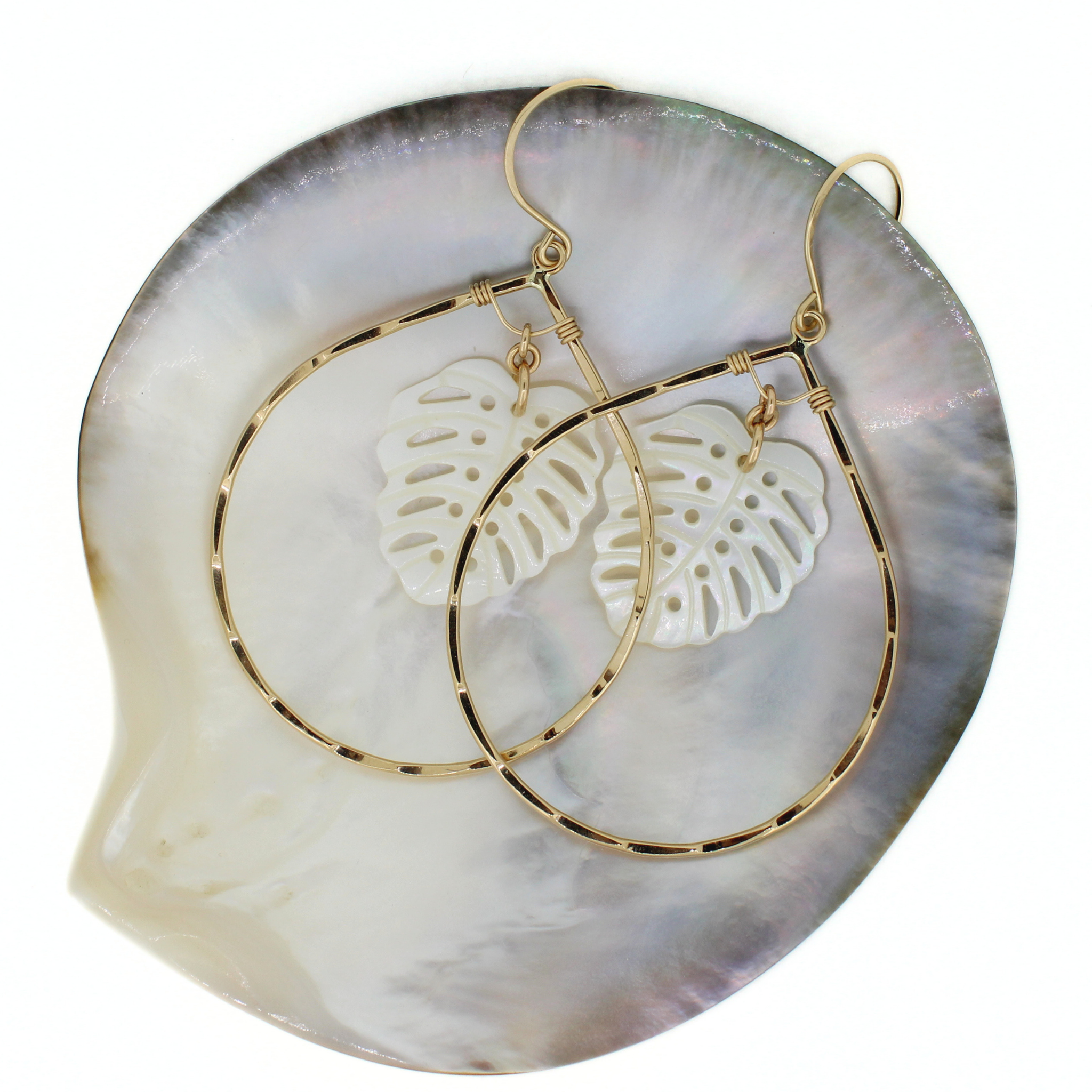 Brianne & Co. 14k gold fill tear drop hoop earrings featuring white mother of pearl monstera leaves