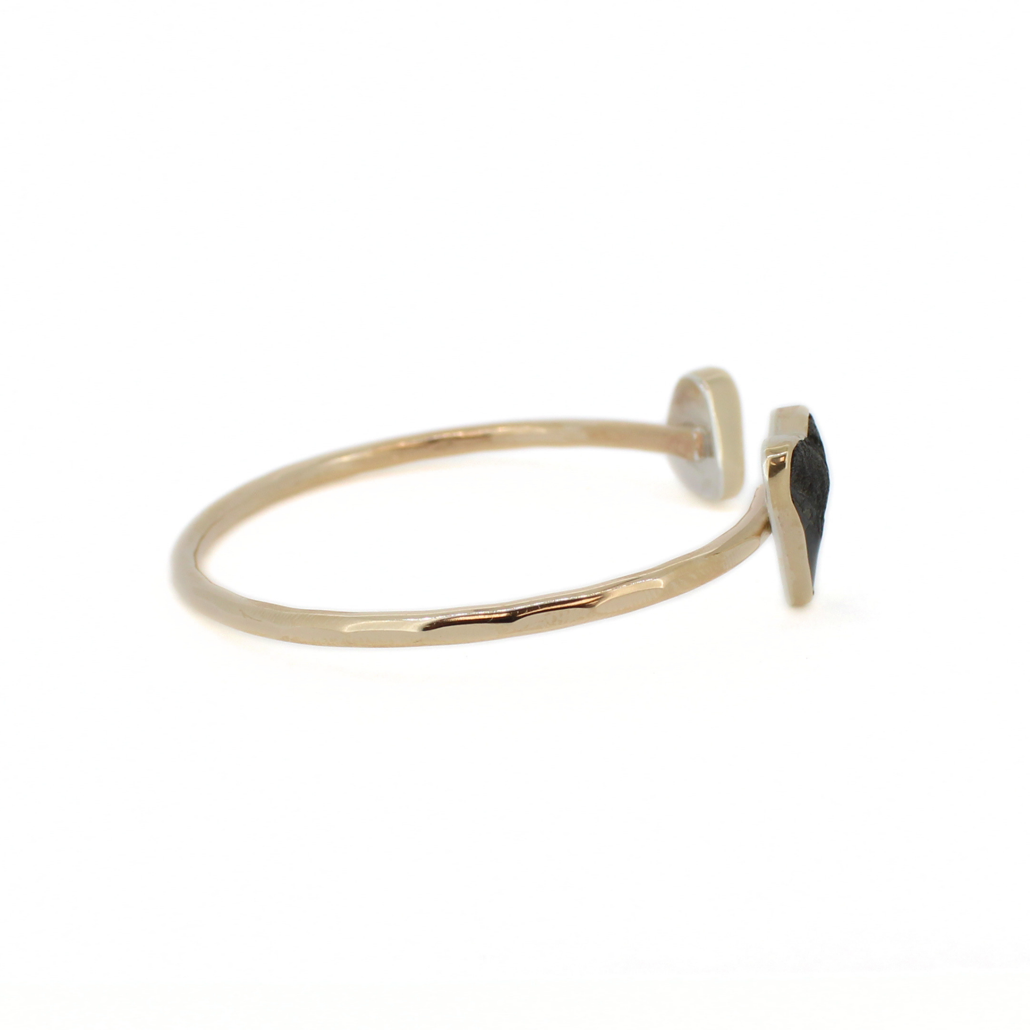 Gold shark-tooth cuff bracelet with black tooth accent and open cuff band