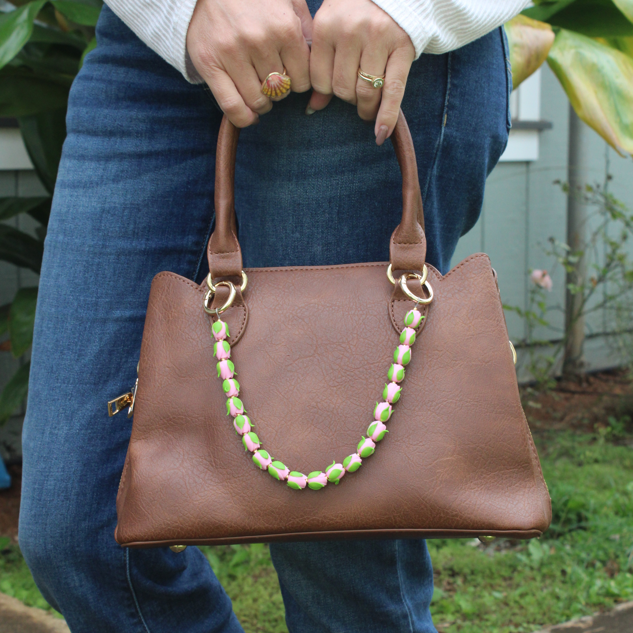 Brianne & Co. purse lei accessory featuring pink and green clay roses perfect for smaller handbags