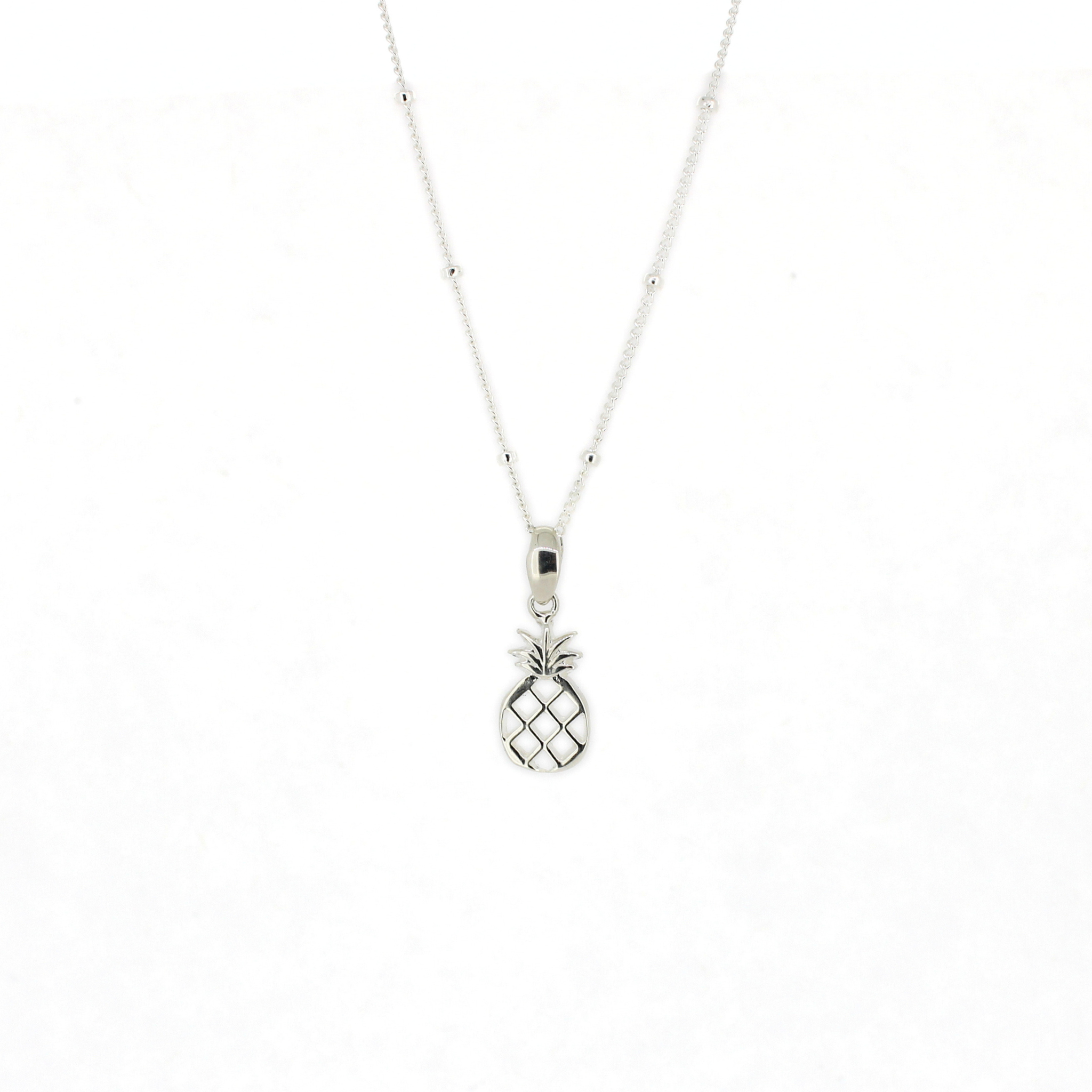 Brianne & Co. Silver pineapple pendant necklace on a white background