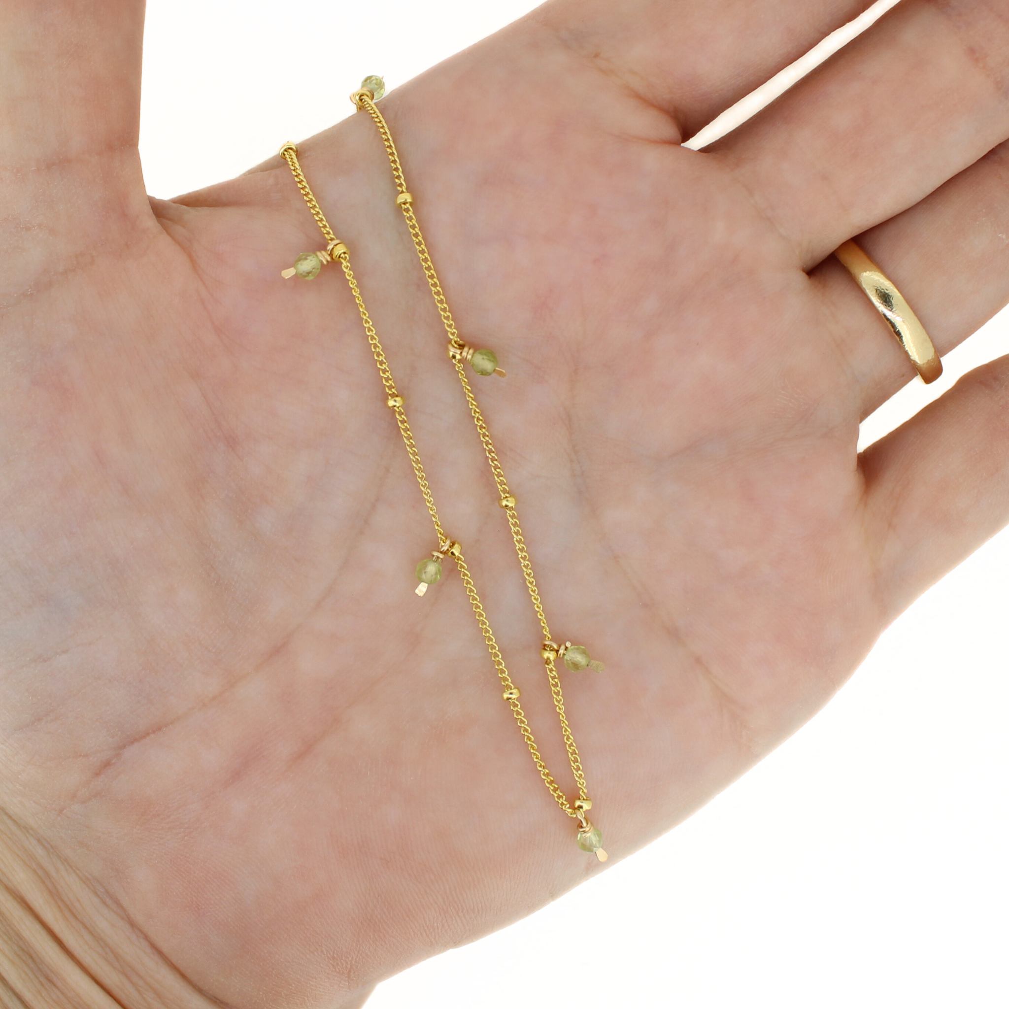 Gold anklet with green peridot-style gemstone beads and fine chain links