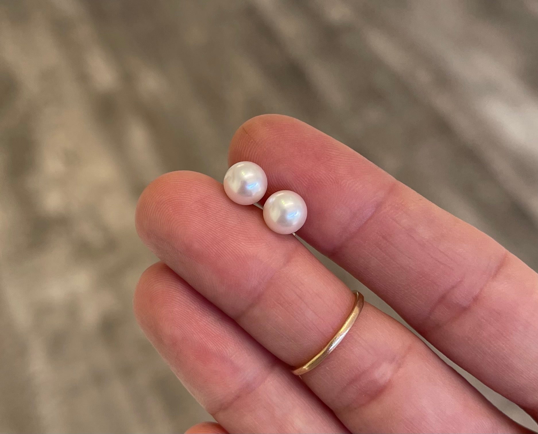 18k gold pearl stud earrings with two white round pearls on posts