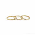 14k gold engraved rings stacked on a white background by Brianne & Co.