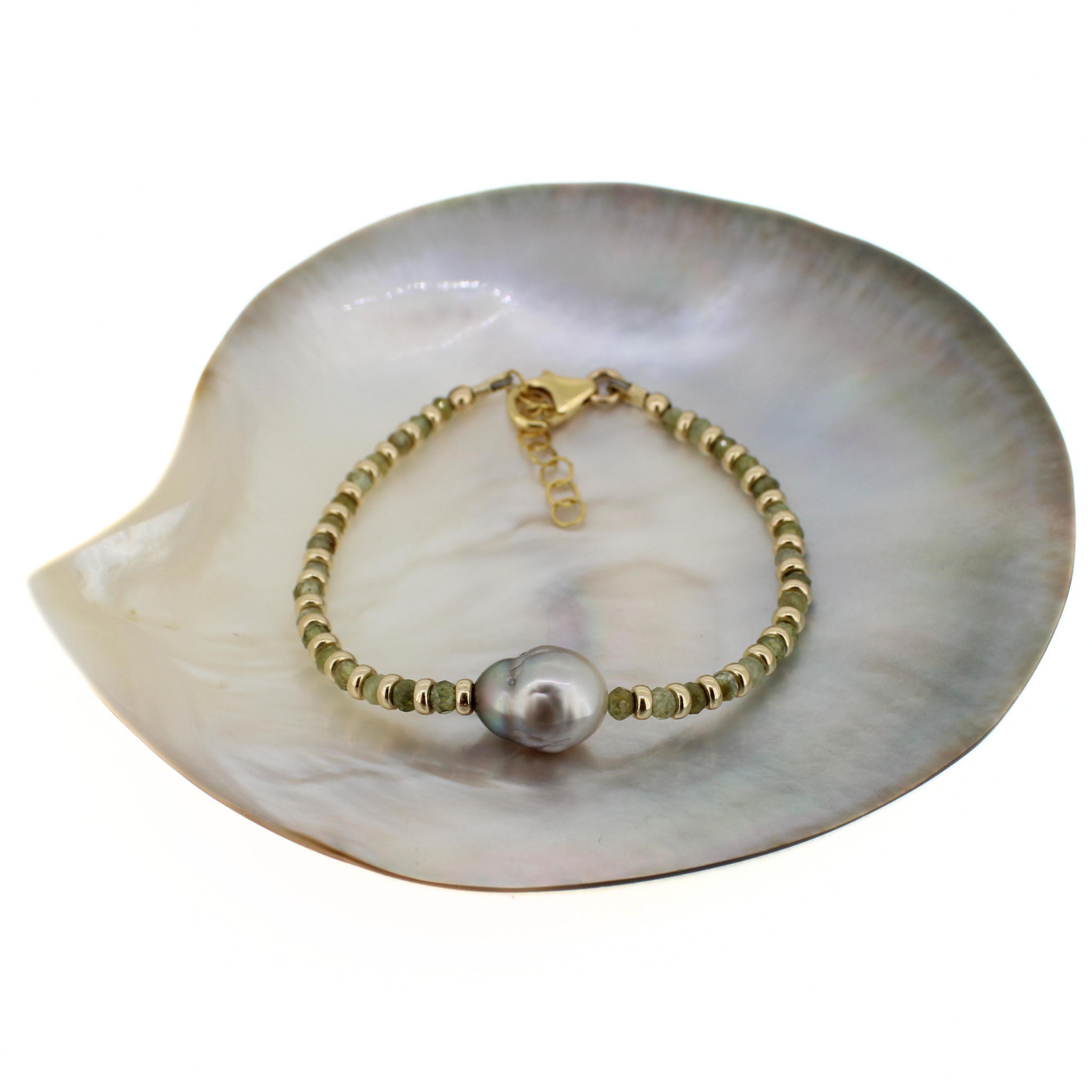 Brianne & Co. 14k gold fill bracelet featuring faceted green garnet and a baroque Tahitian pearl