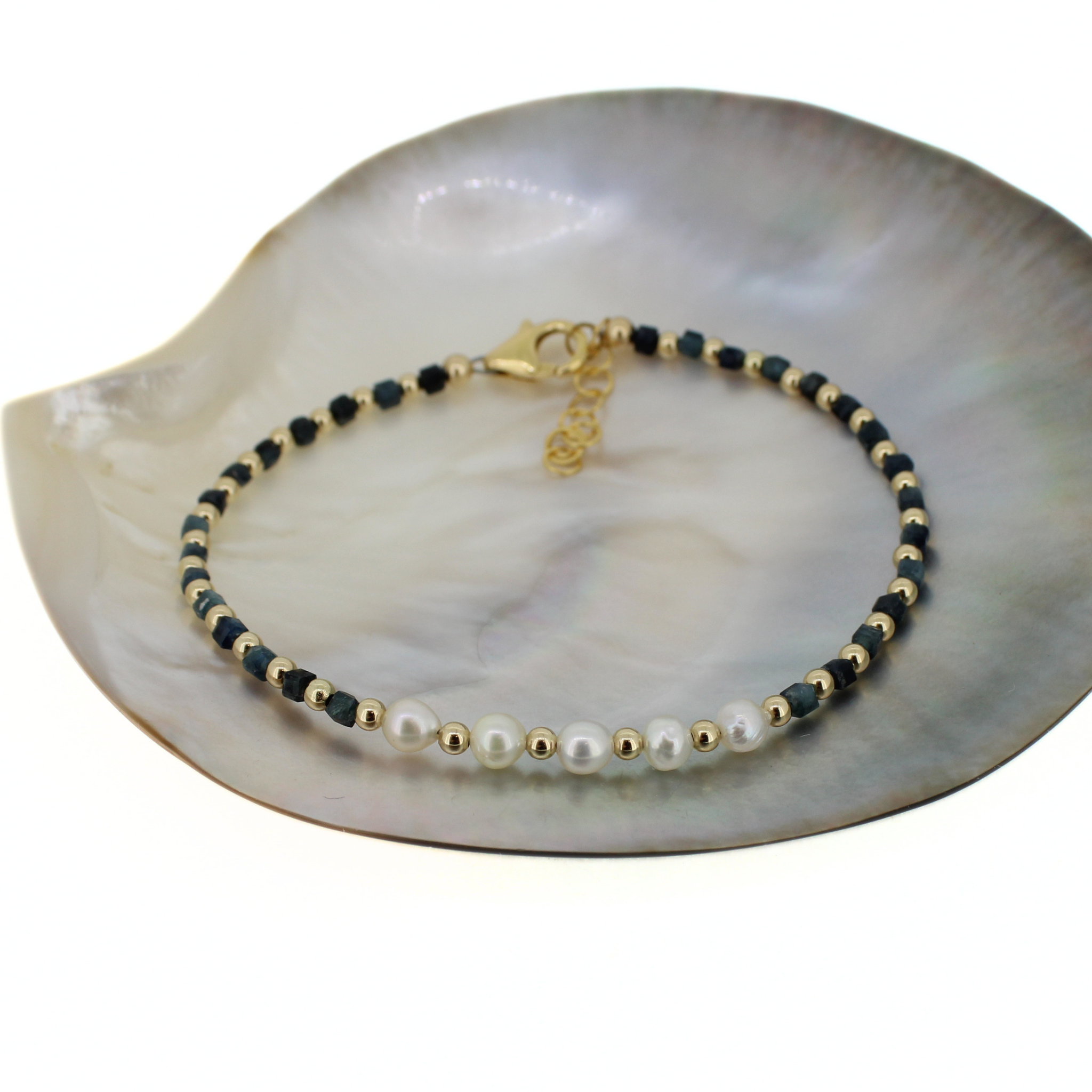 Brianne & co. 14k gold fill bracelet featuring white akoya pearls and dark blue tourmaline gemstones