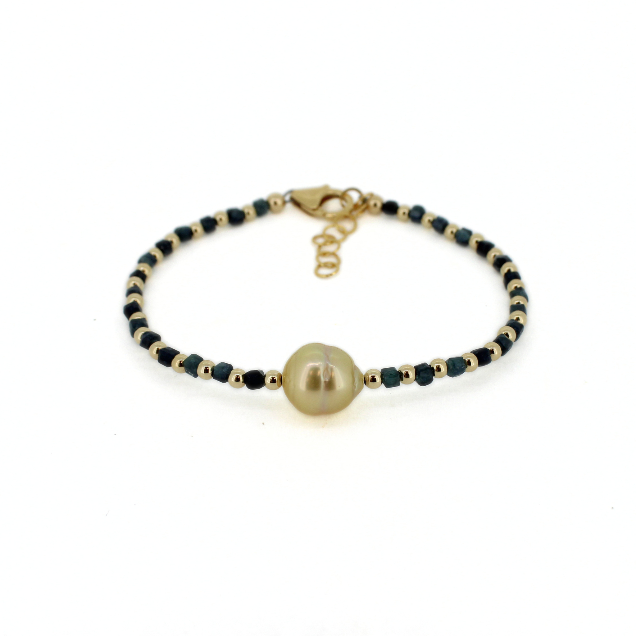 Brianne & Co. 14k gold fill bracelet featuring a golden south sea pearl and dark blue tourmaline gemstones