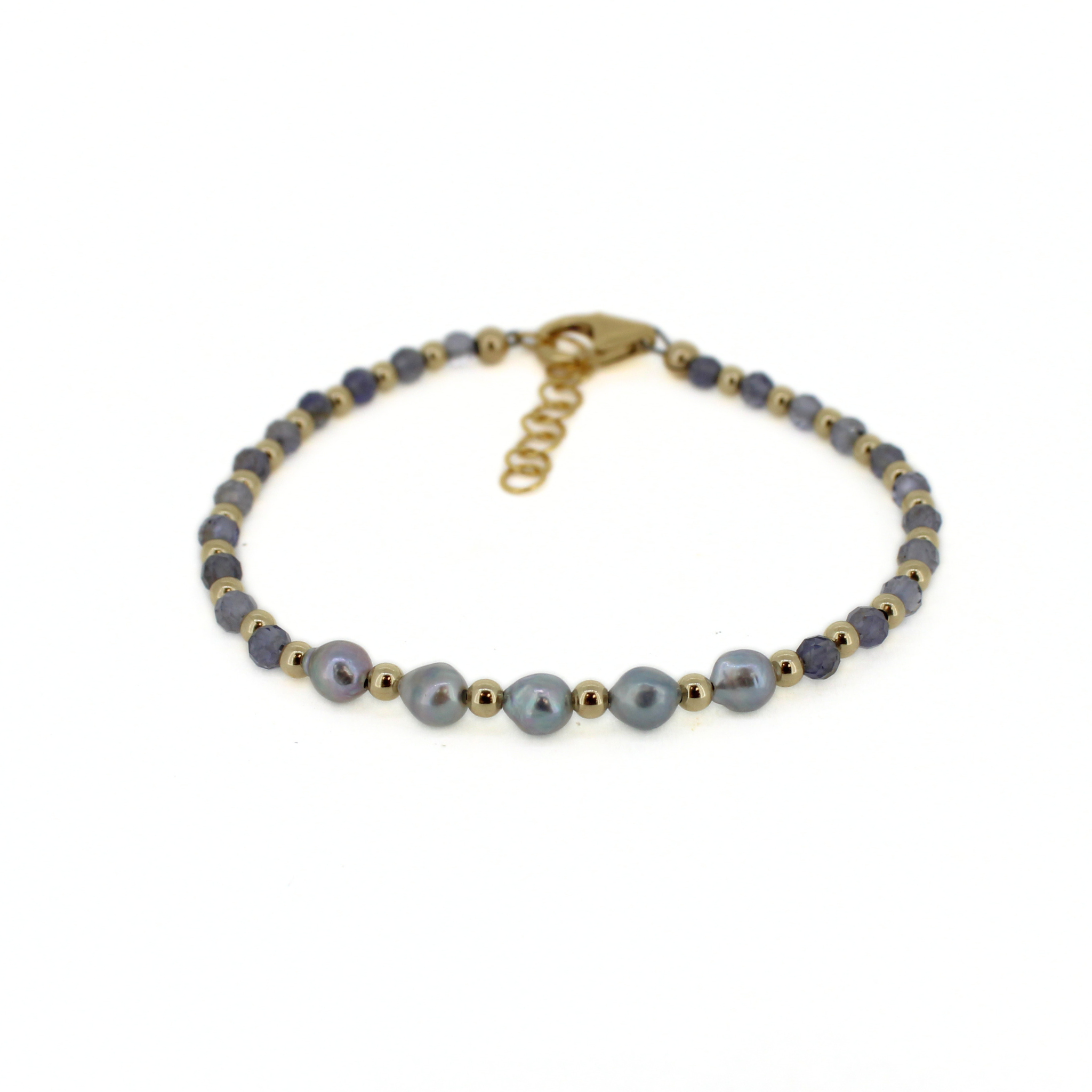 Brianne & Co. 14k gold fill bracelet featuring tiny akoya pearls and faceted iolite gemstones