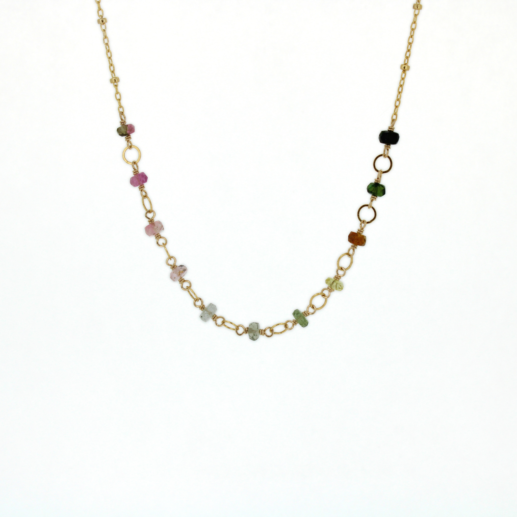A delicate gold chain necklace featuring small, multi-colored tourmaline gemstone beads and openwork gold links, displayed against a plain white background. Handmade in Kauai, Hawaii by Brianne & Co.