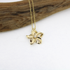 Brianne and Company 14k gold cutout flower pendant on baby rope chain
