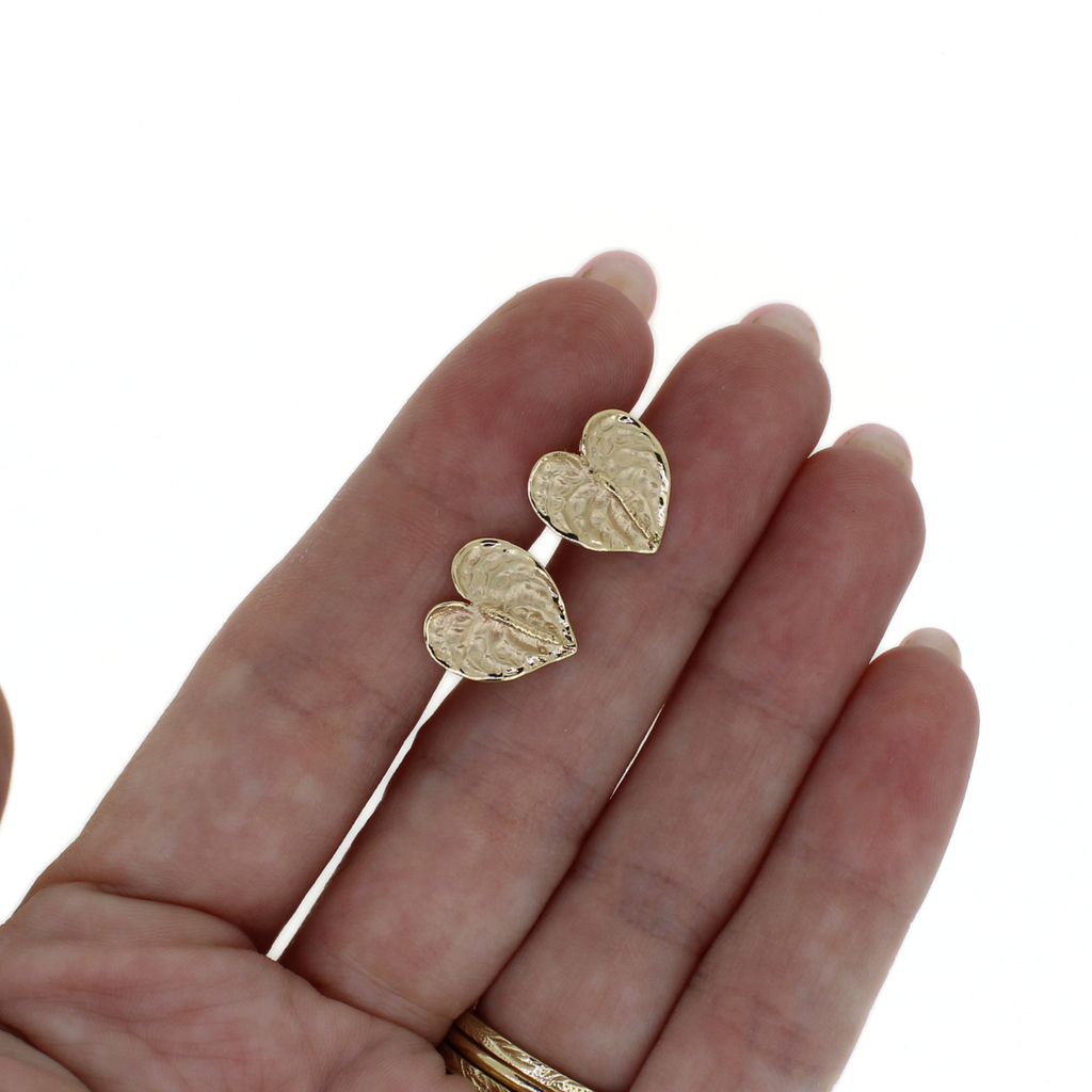 Brianne & Co. 14k gold anthurium flower stud earrings on hand for size reference