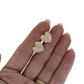 Brianne & Co. 14k gold anthurium flower stud earrings on hand for size reference