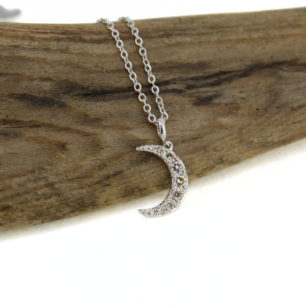 Brianne & Co. 14k white gold diamond moon necklace close up with 7 tiny diamonds