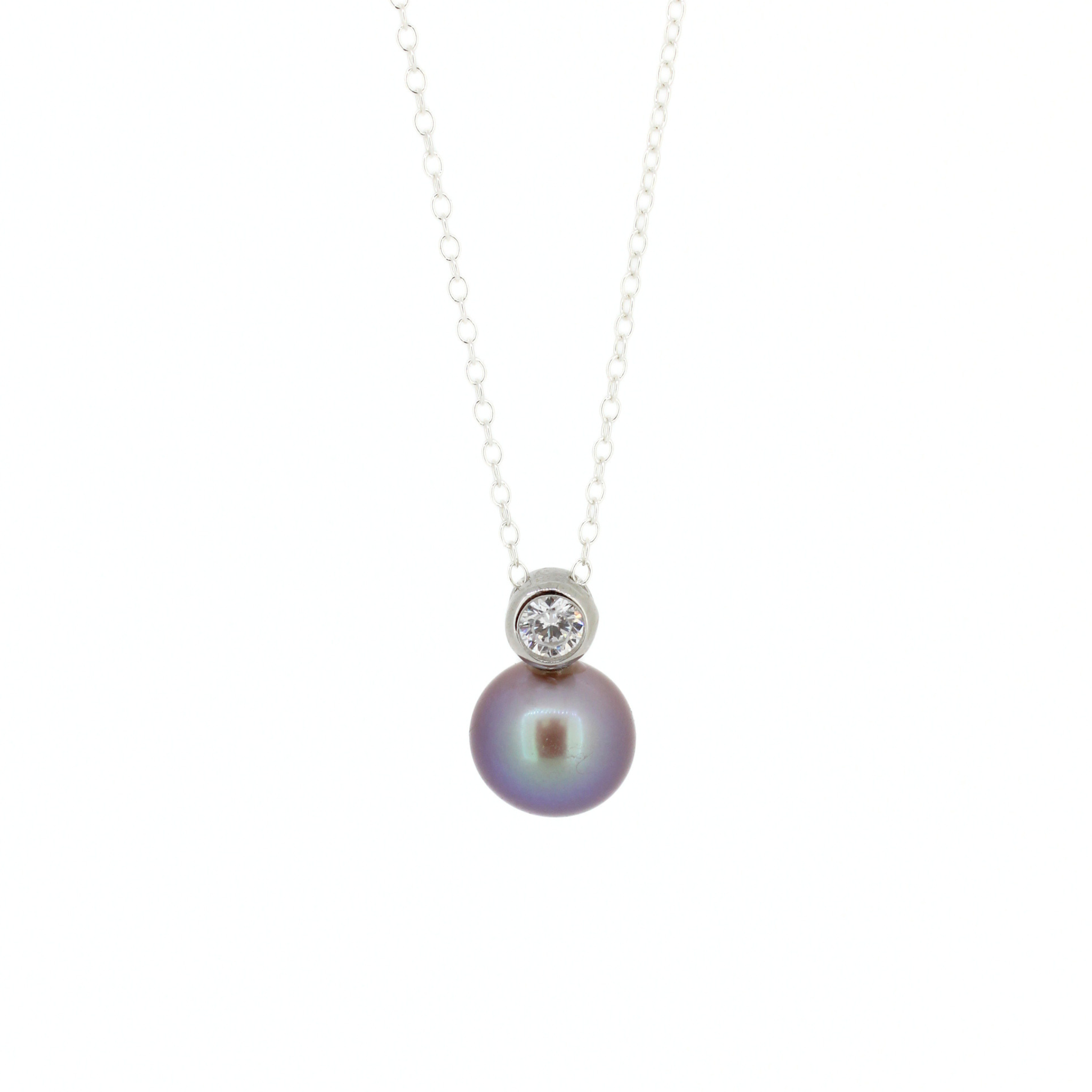 Sterling silver necklace with a deep purple fresh water Edison pearl and a bezel set cubic zirconia accent.