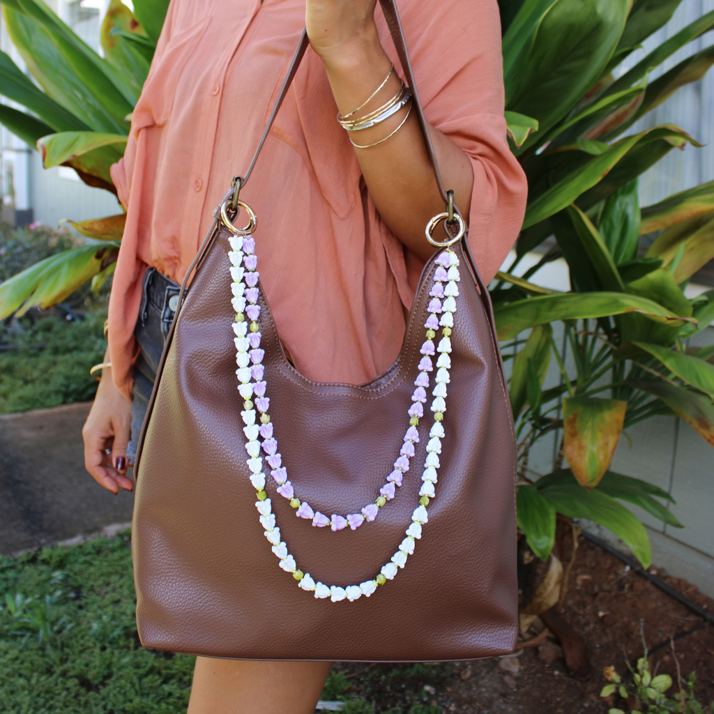 Brianne & Co. double strand crown flower and pakalana flower purse lei