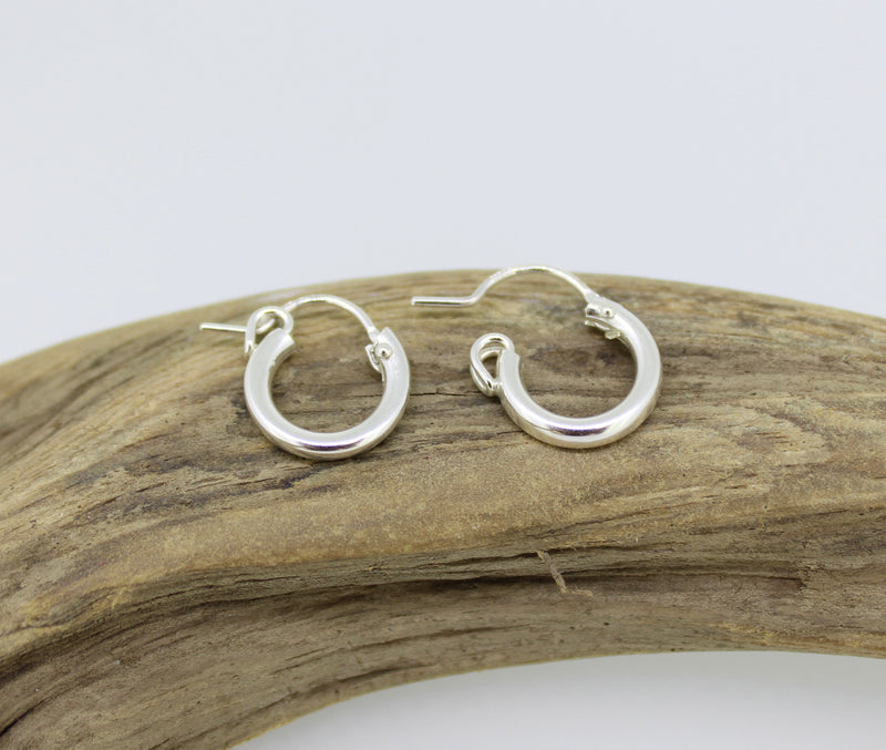 Sterling silver huggie hoop earrings by Brianne & Co.