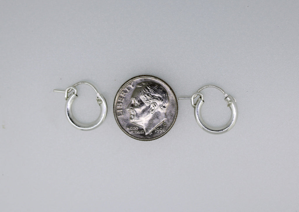 Sterling silver huggie hoop earrings by Brianne & Co.