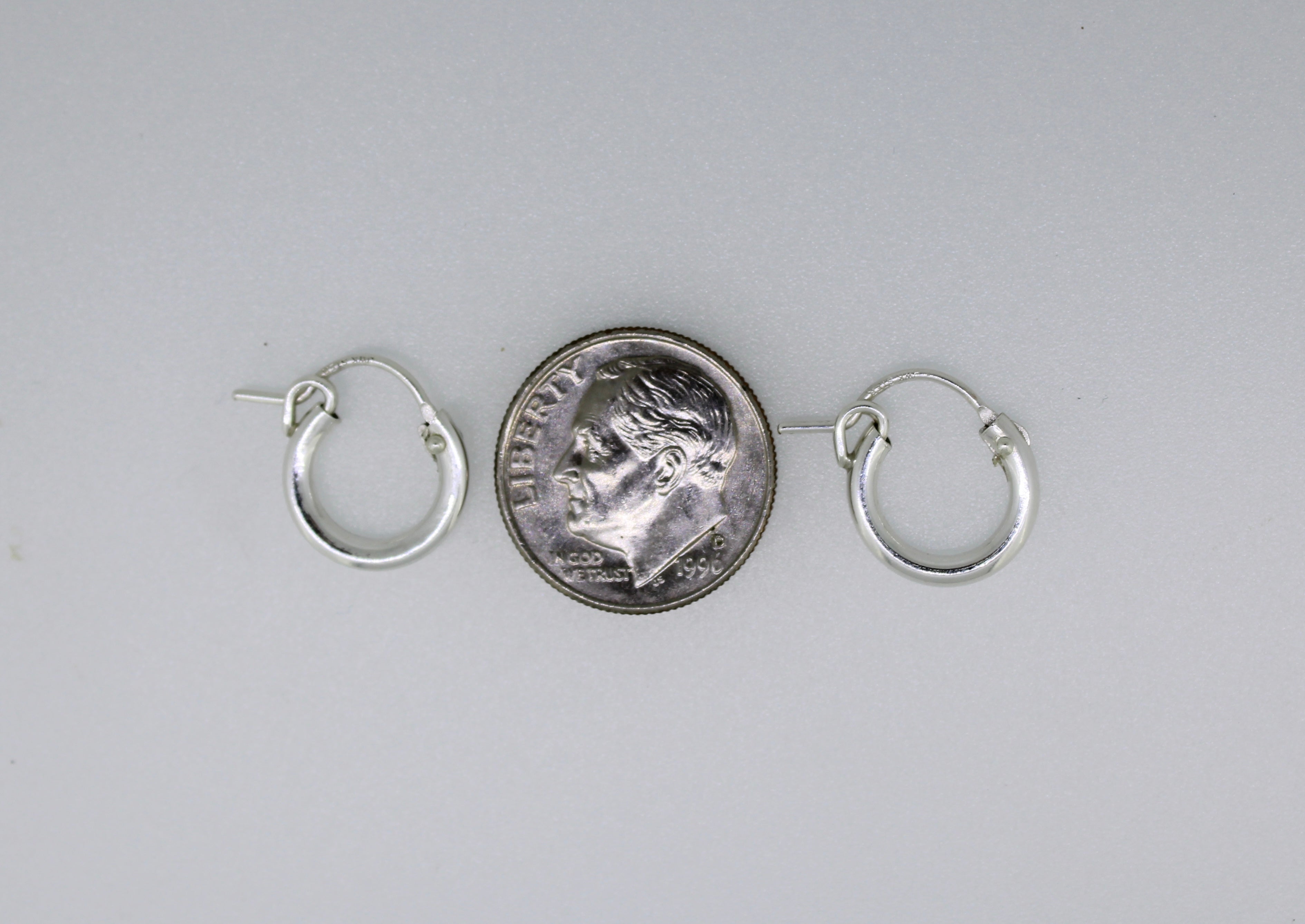 Sterling silver huggie hoop earrings by Brianne & Co.