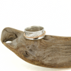 Brianne and Co Sterling Silver and Gold Fill Puakenikeni Spinner Ring on a piece of wood