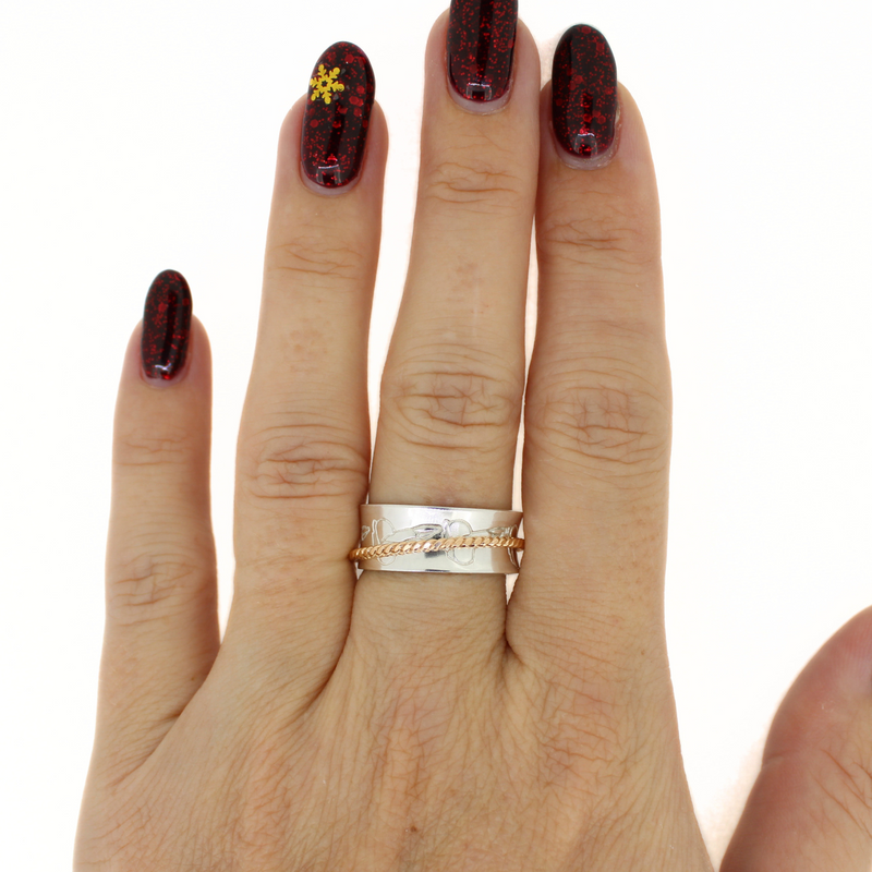 Brianne and Company Sterling Silver and Gold Fill Puakenikeni Spinner Ring on a hand