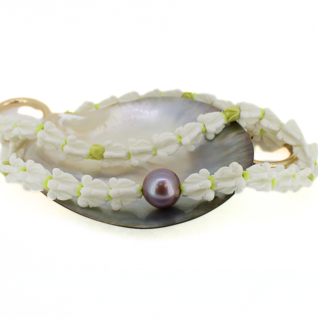 Brianne & co. crown flower and Edison pearl long purse lei