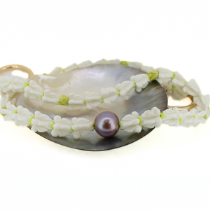 Brianne & co. crown flower and Edison pearl long purse lei