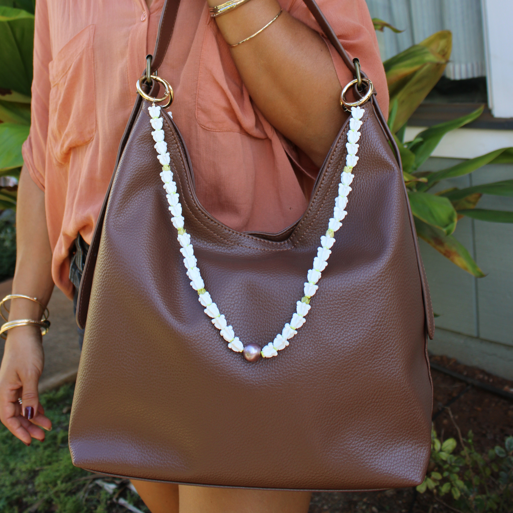 Brown leather handbag with a decorative crown flower purse lei handmade by Brianne & co.