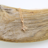 Brianne & Co. 14k rose gold necklace with tiny diamond star pendant