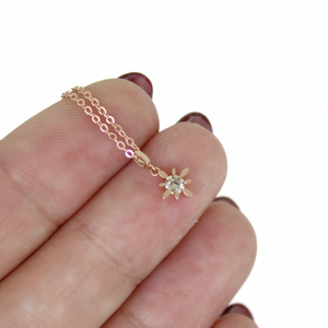 Brianne & Co. 14k rose gold diamond star necklace on hand