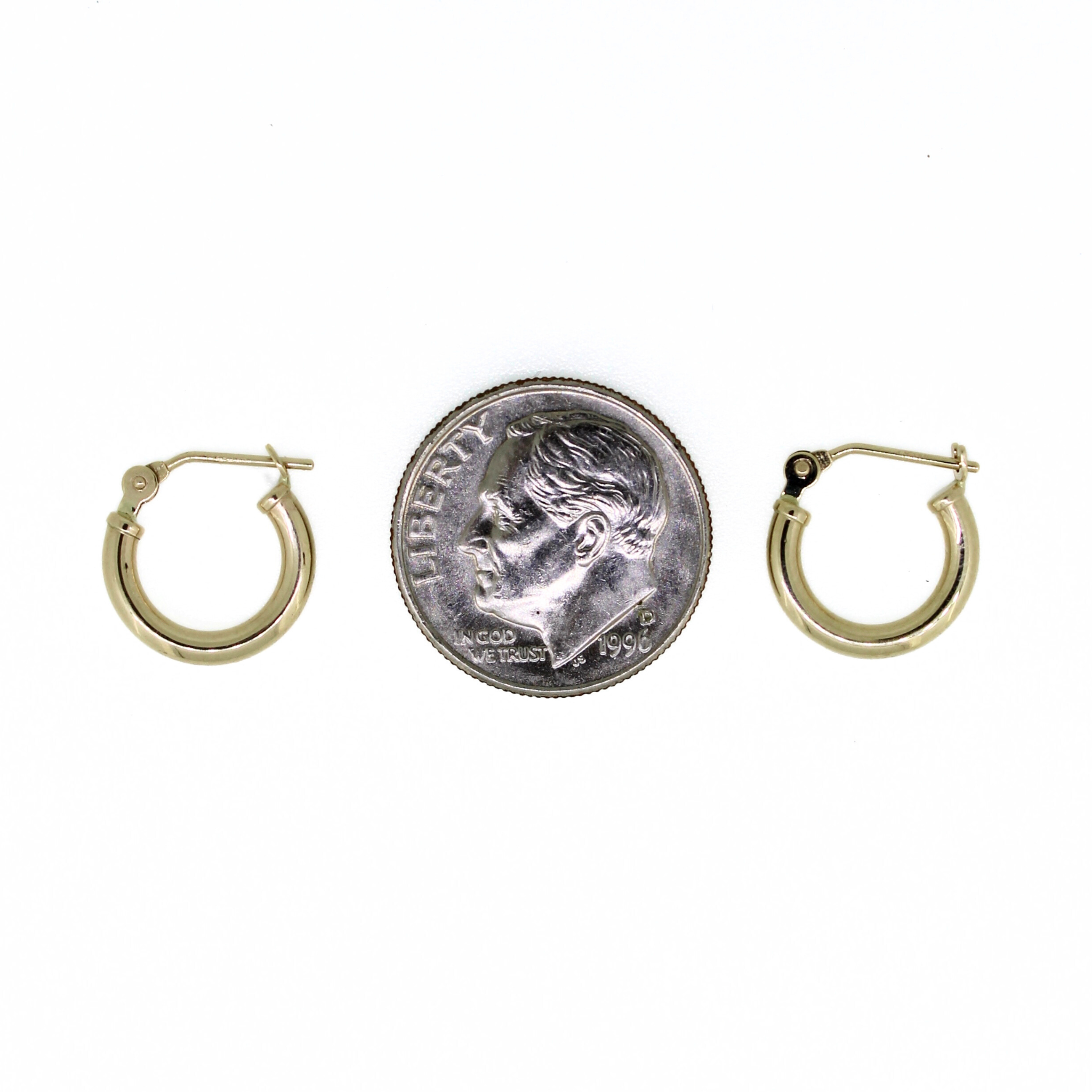 Brianne & Co. 14k yellow gold 12mm hoop earrings next to US dime for size reference