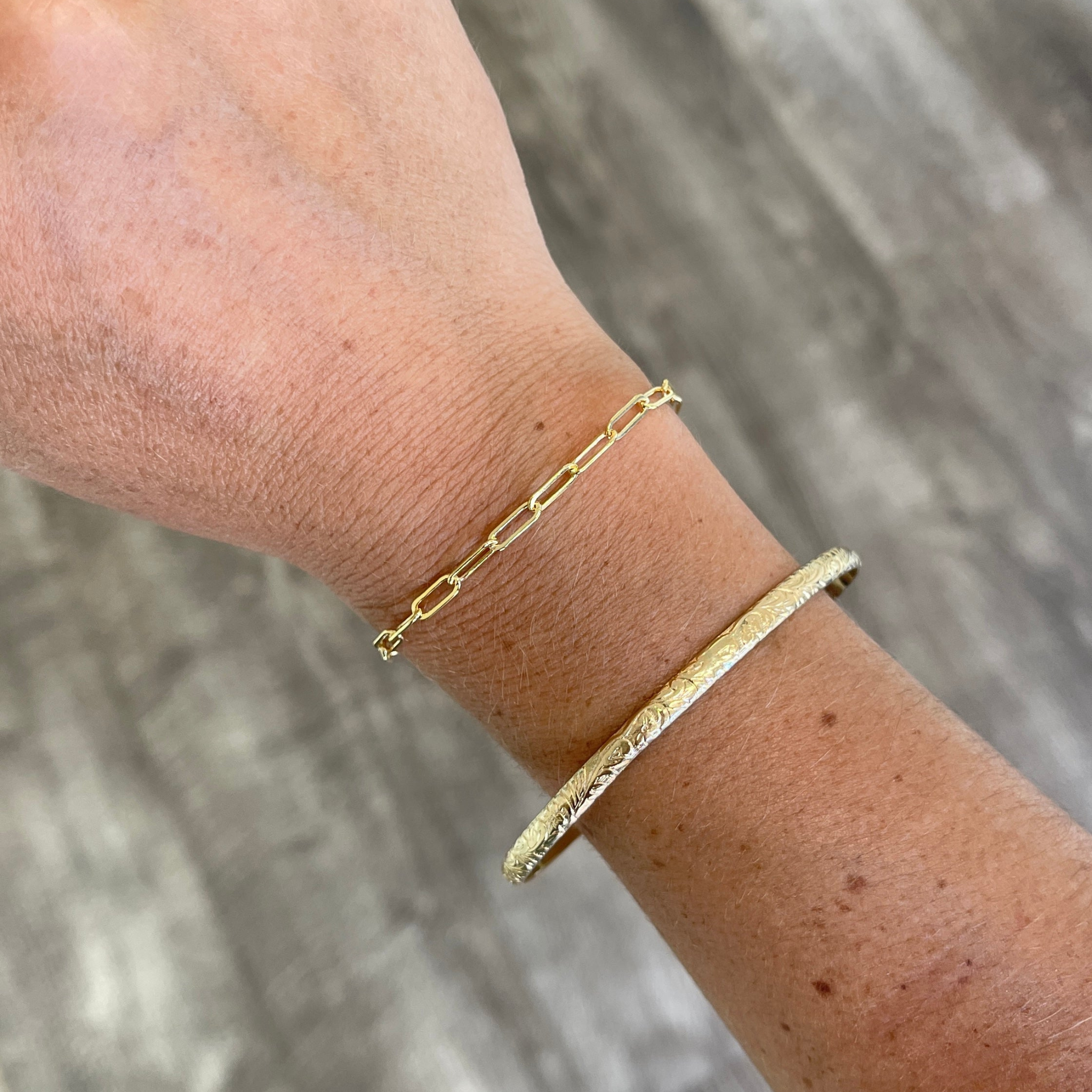 Brianne & Co. 14k gold filled thick paper clip bracelet on wrist for size reference