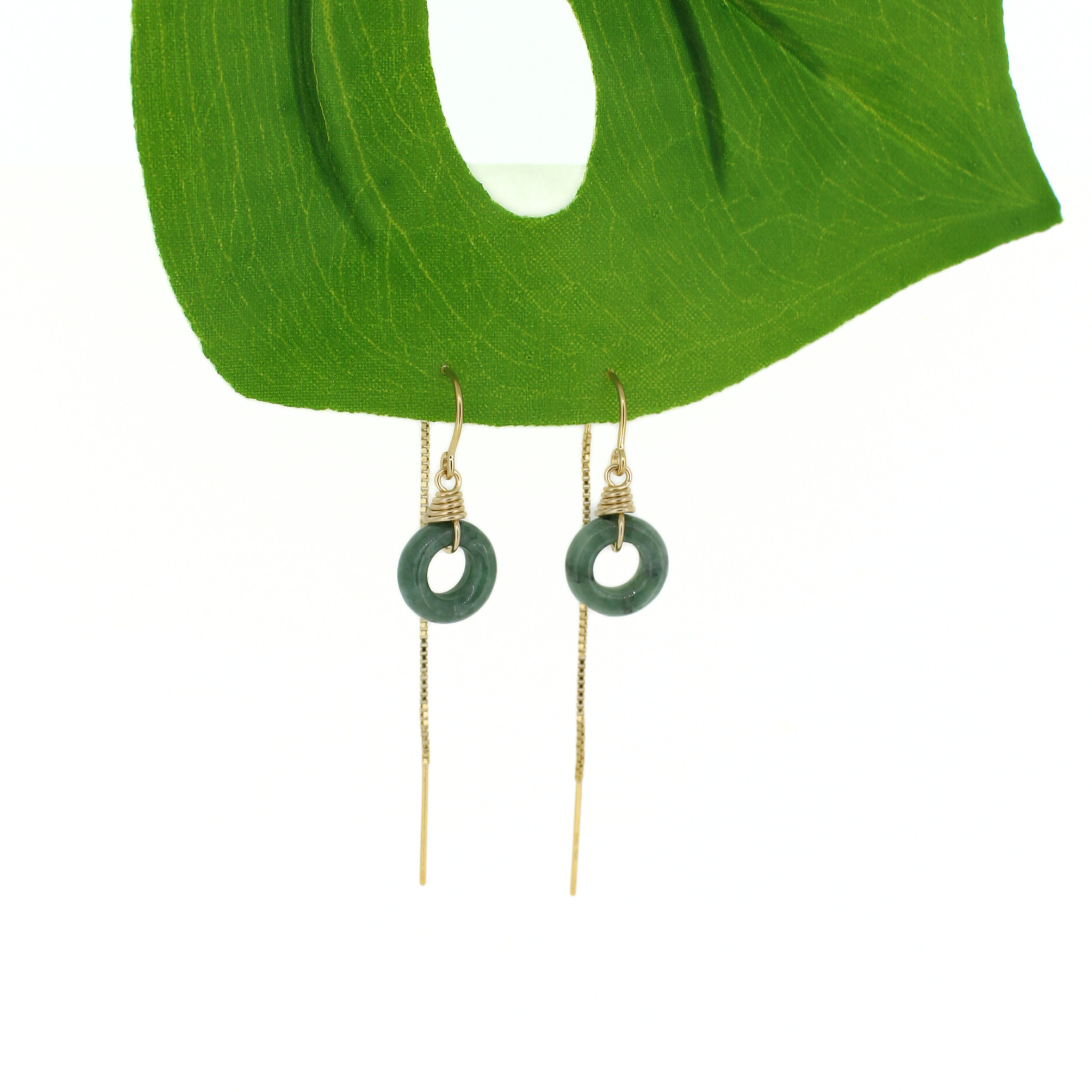 Brianne & Co. 14k gold fill threader style earrings featuring green jade donut shaped gemstones