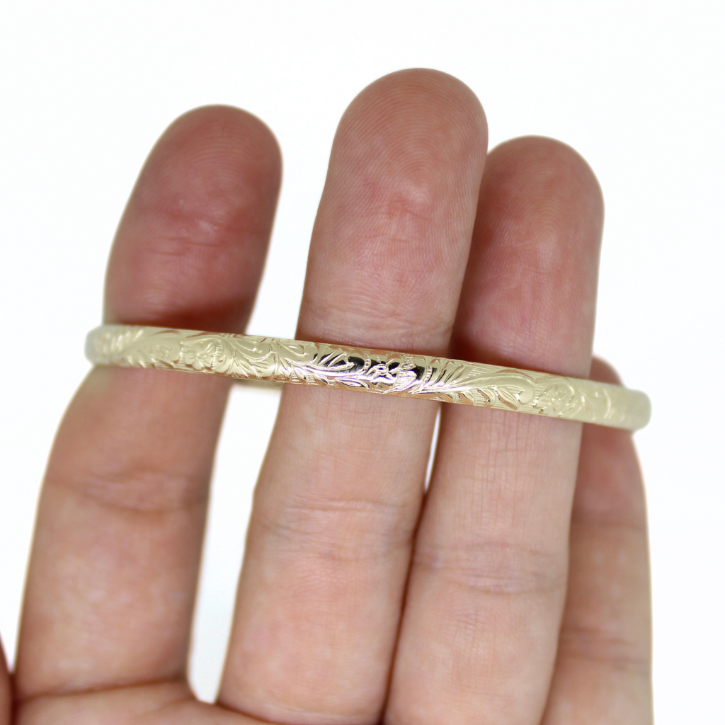 Brianne & Co. close up detail of the gold fill Hawaiian heirloom style bangle