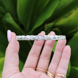 Brianne & Co. sterling silver traditional Hawaiian heirloom bangle bracelet hand engraved with "Kuuipo" and a scroll and flower pattern design